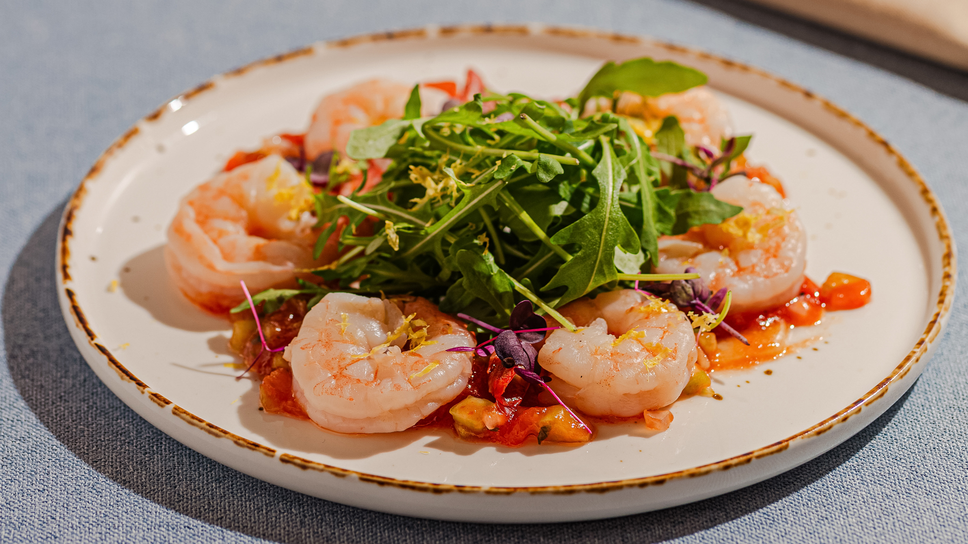 a plate of shrimp and salad