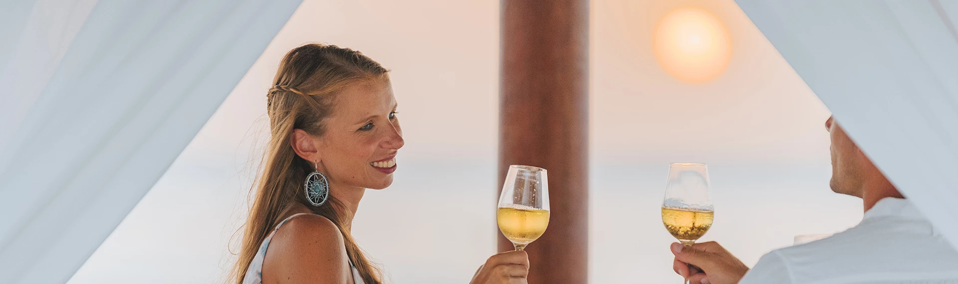 a woman holding a glass of wine