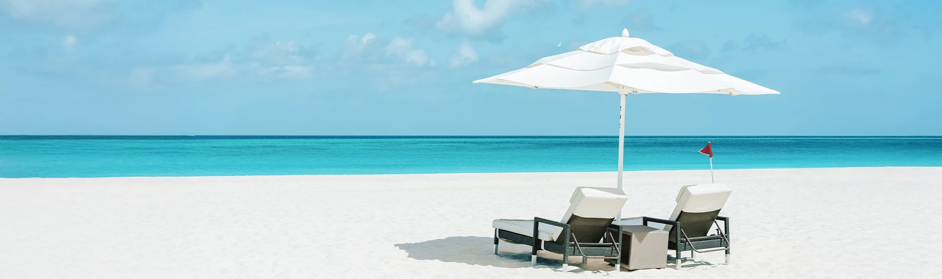 a beach chair and umbrella on a sunny day