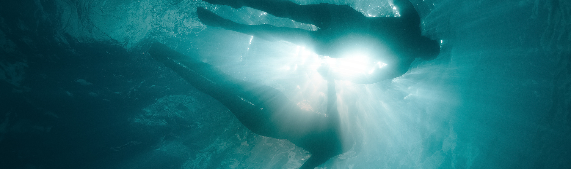 a person swimming under water