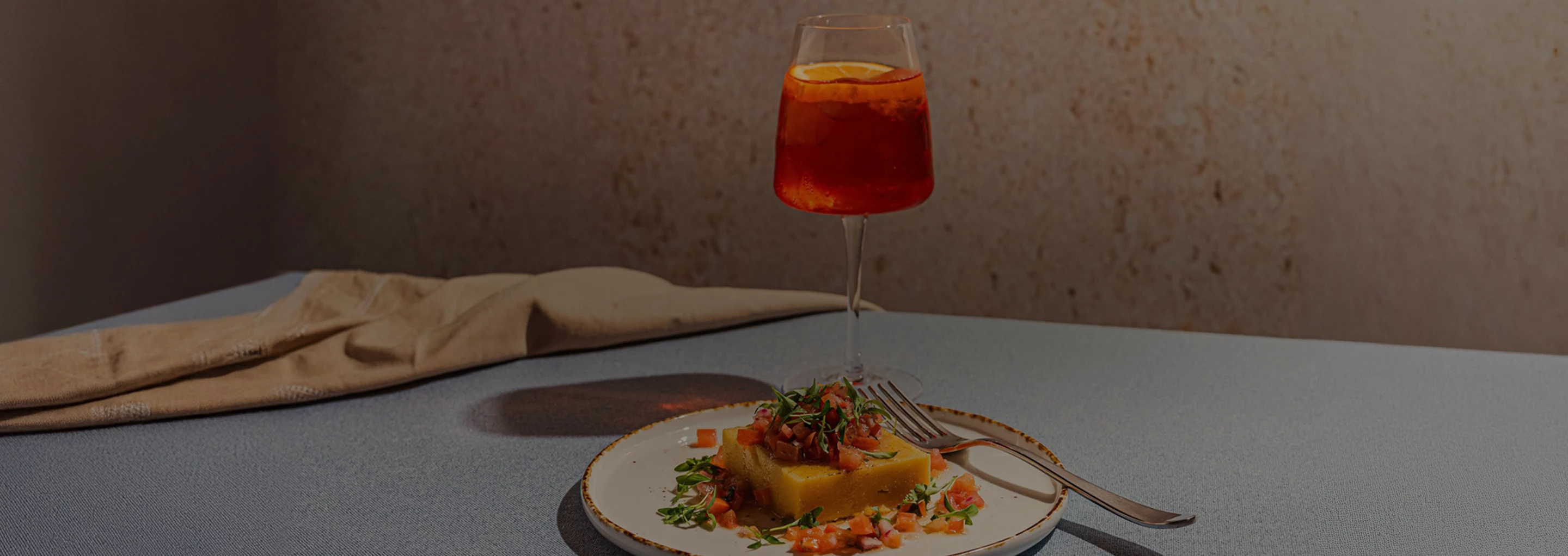 a plate of food and a glass of liquid