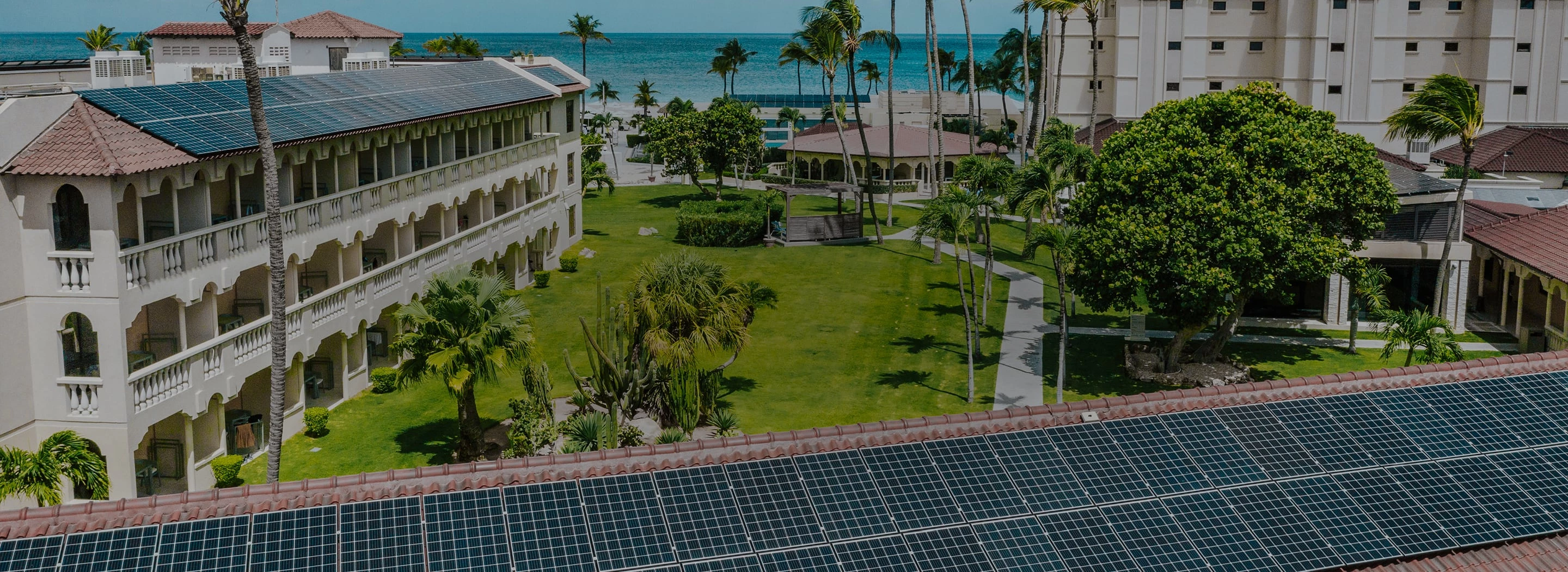 a solar panels on a lawn next to a building