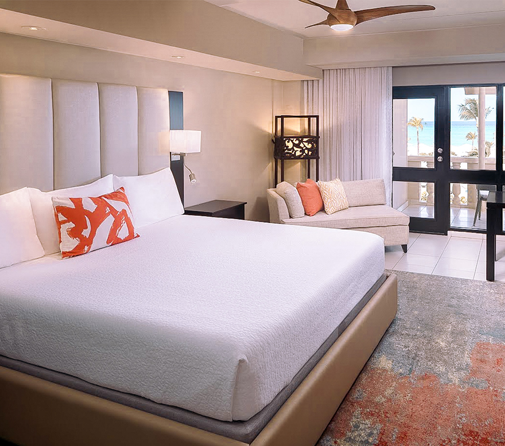 a bedroom with a large bed and a couch