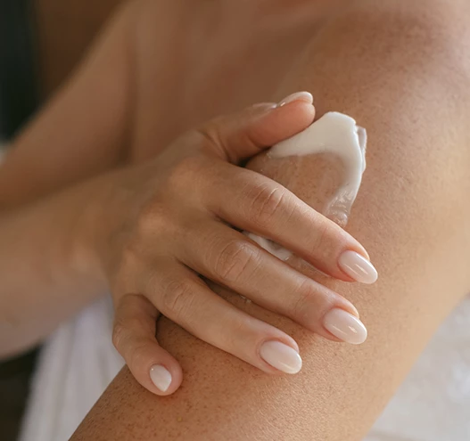 a person applying cream on their arm