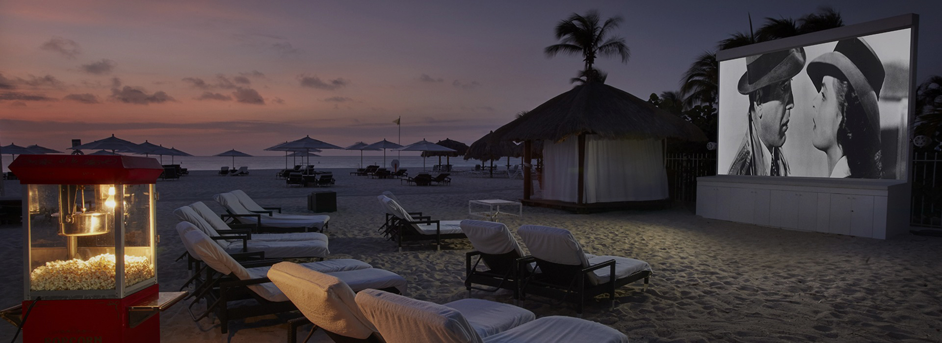 a beach with chairs and umbrellas
