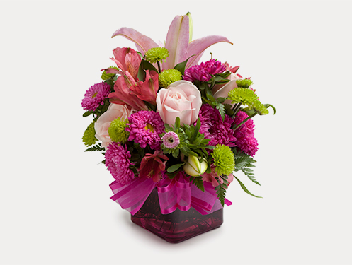 a bouquet of flowers in a glass vase