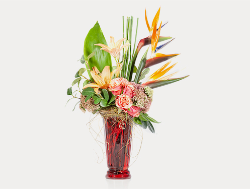 a vase with flowers and leaves