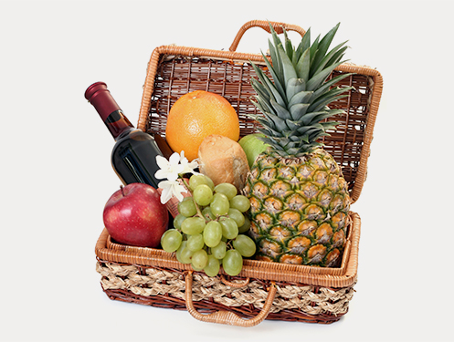 a basket full of fruit and wine