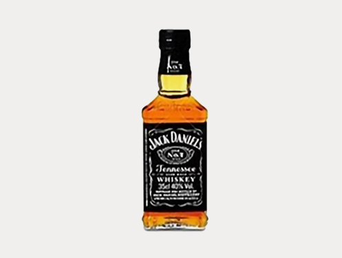 a bottle of whiskey with a black label with Jack Daniel&#39;s in the background
