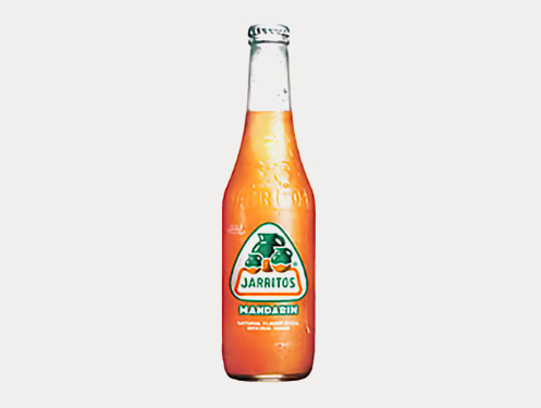a glass bottle with orange liquid