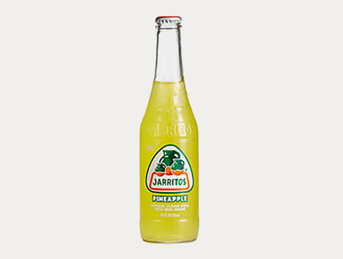 a glass bottle with yellow liquid