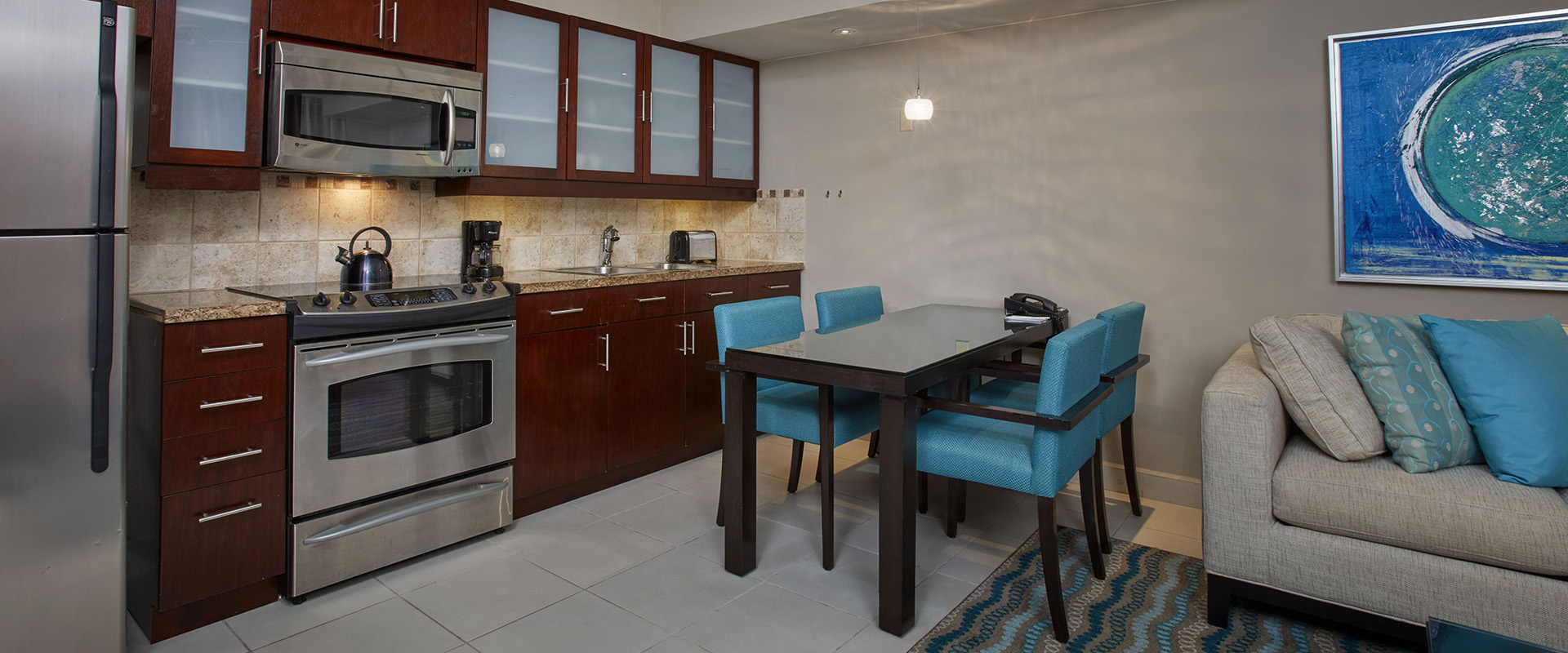 a kitchen with a table and chairs