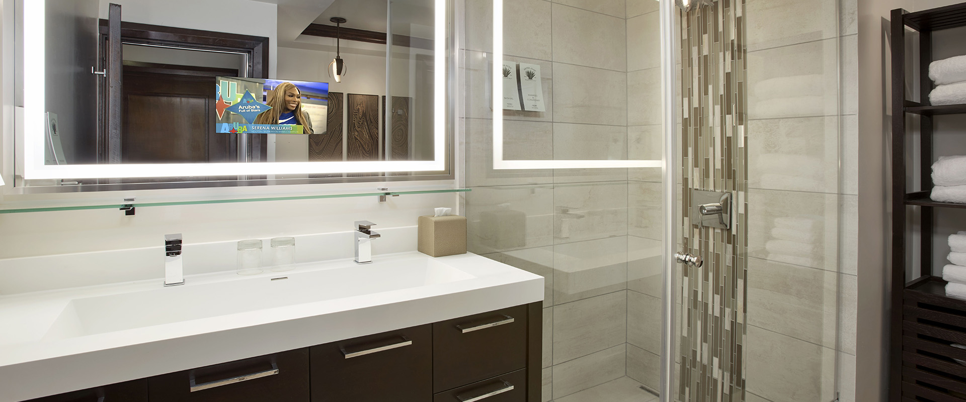 a bathroom with a mirror and a shower