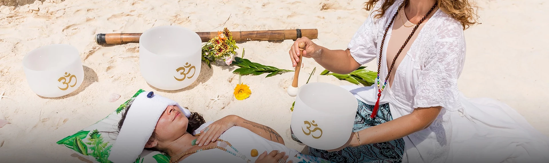 a person holding a stick and lying on a woman's back