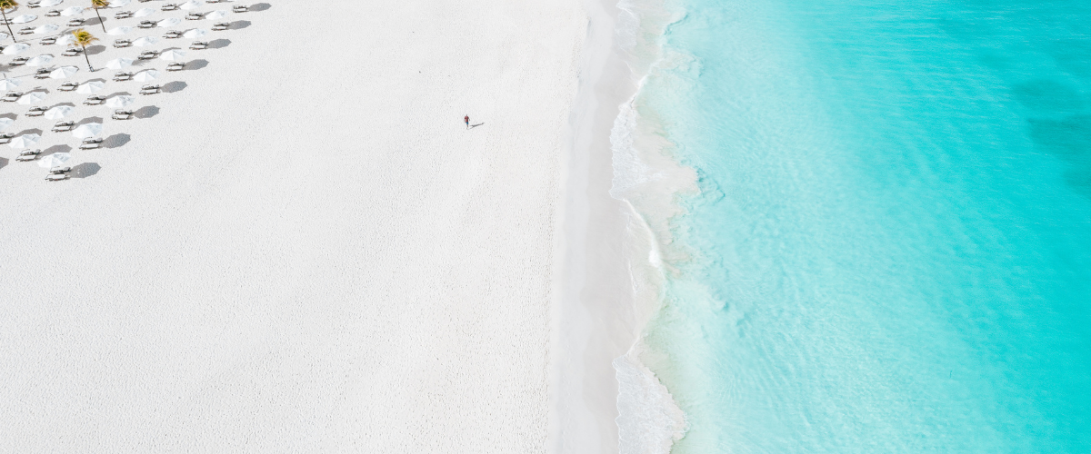 a person walking on a beach
