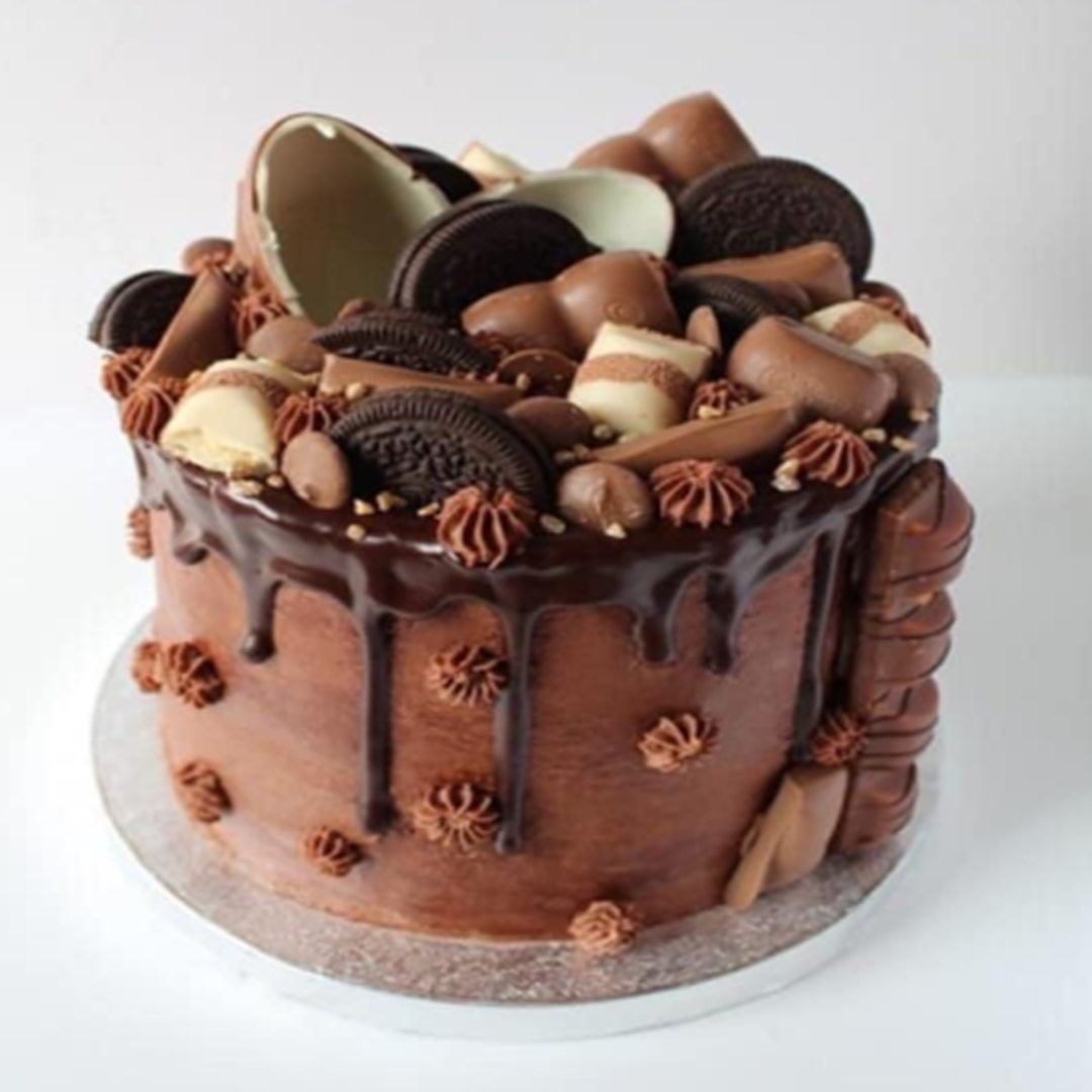 a chocolate cake with chocolate and cookies