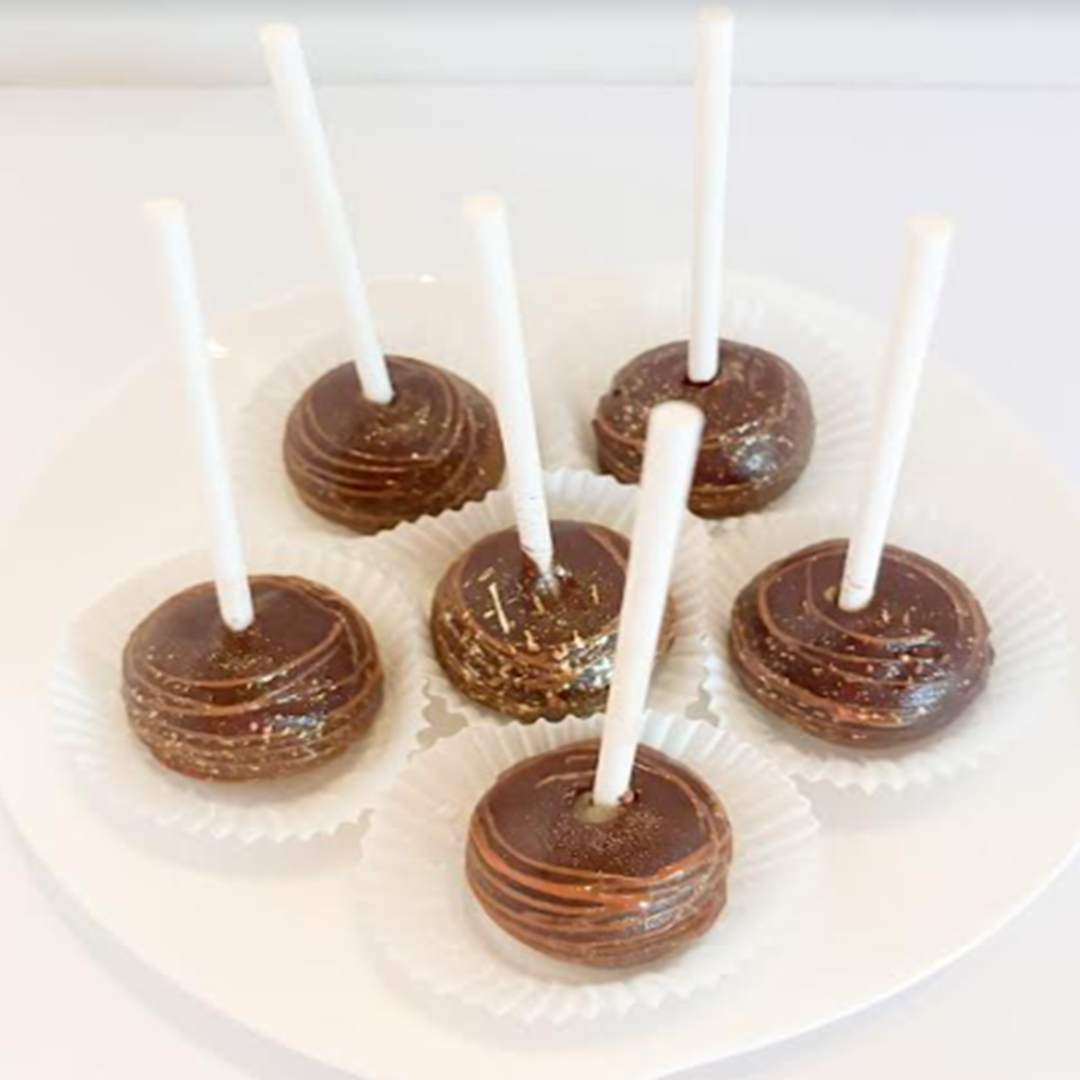 a plate of chocolate cake pops
