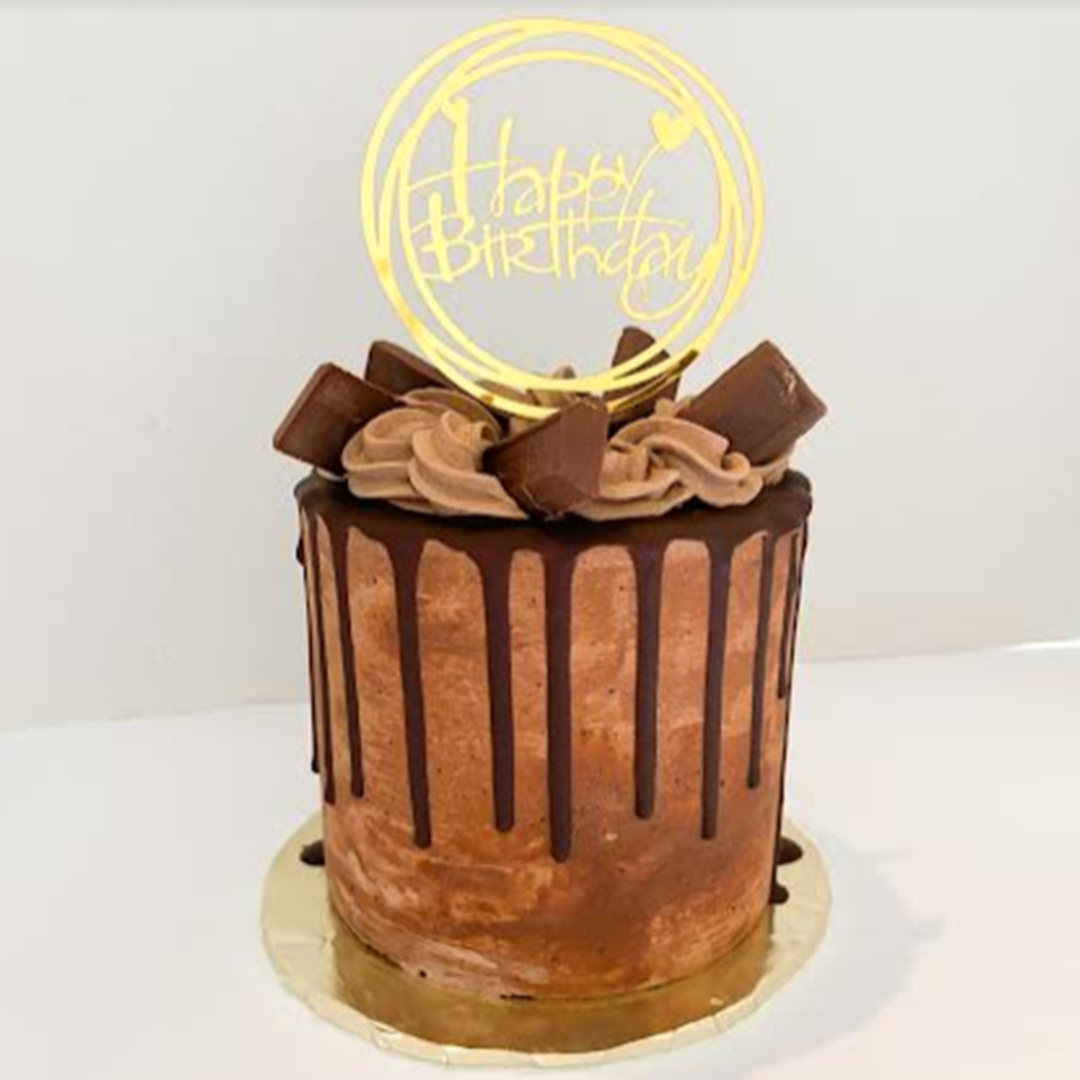 a cake with a happy birthday sign