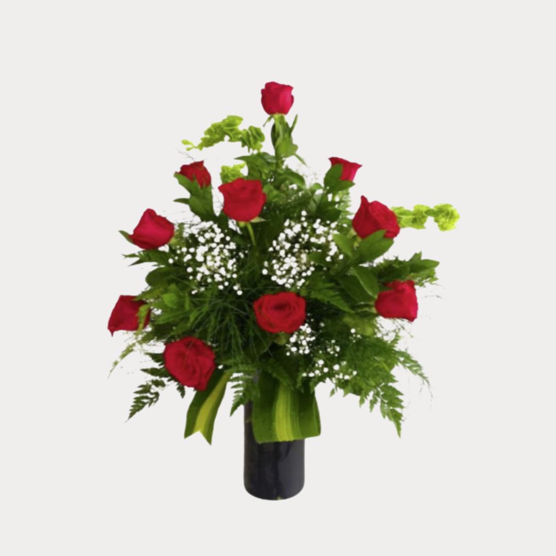 a vase of red roses