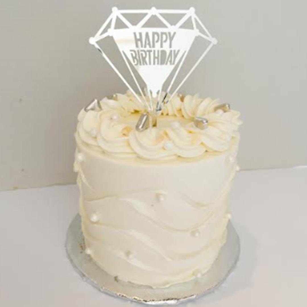 a cake with a diamond topper