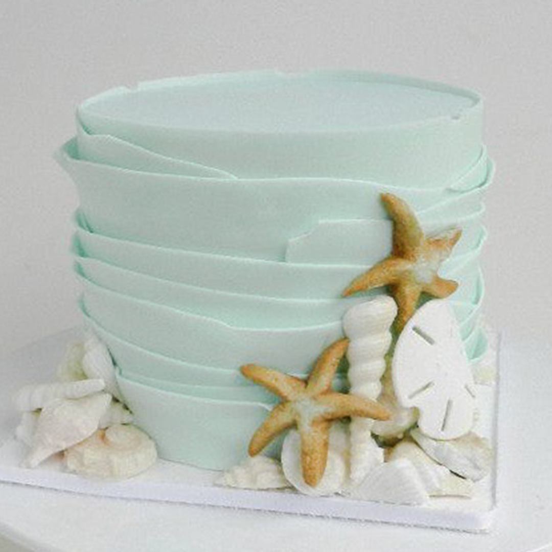 a cake with shells and starfishes