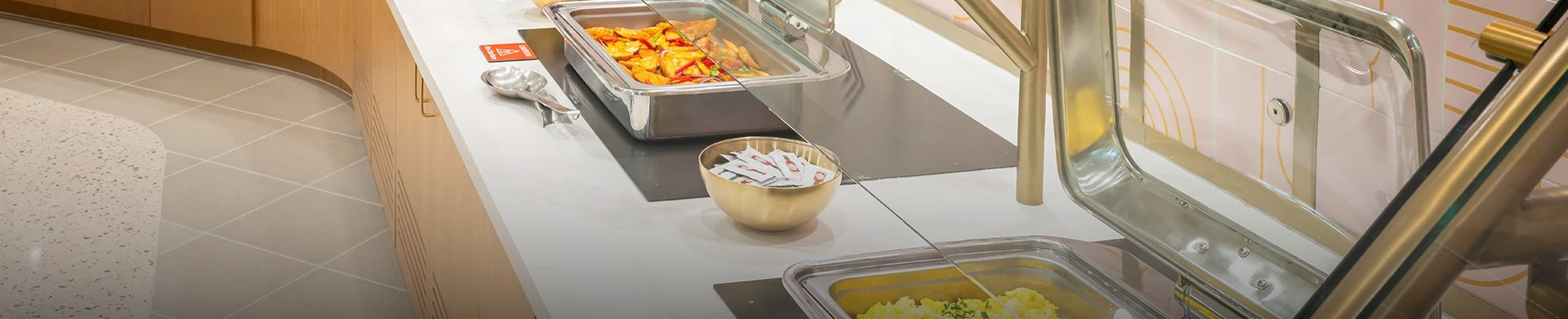 a bowl of food in a buffet