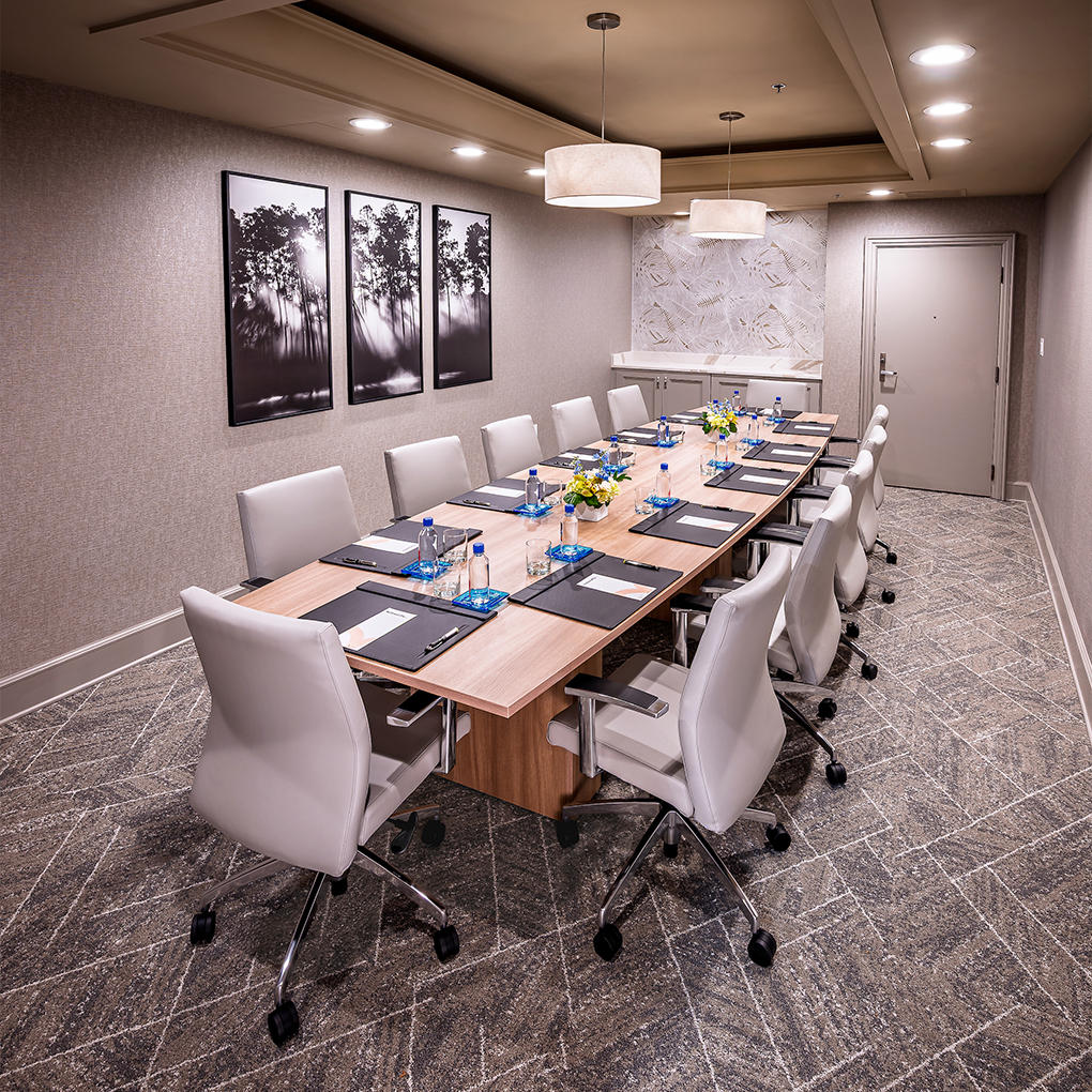 a conference room with a long table and chairs