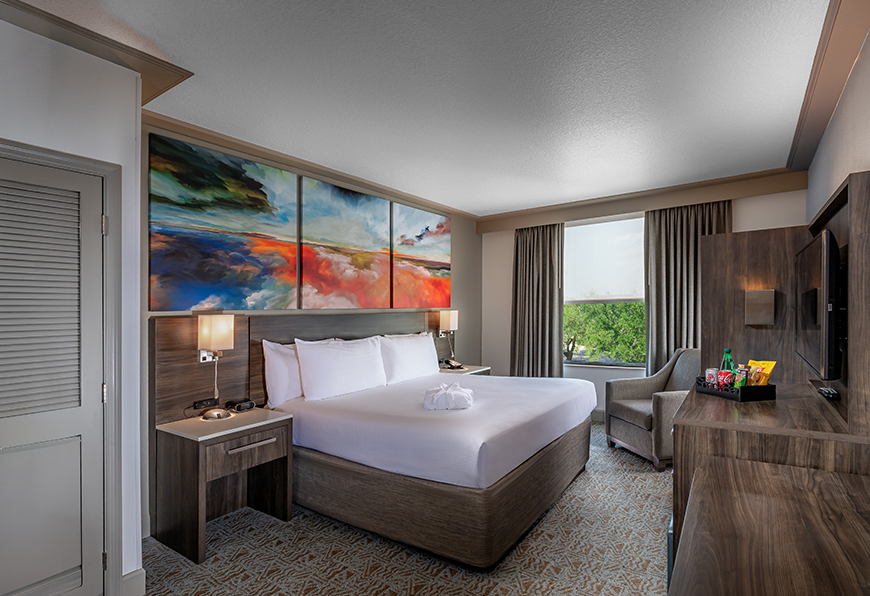a room with a bed and a chair