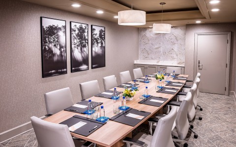 a conference room with a table and chairs