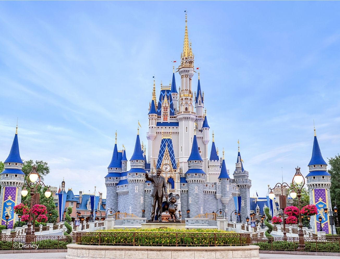 a castle with a statue in front of it