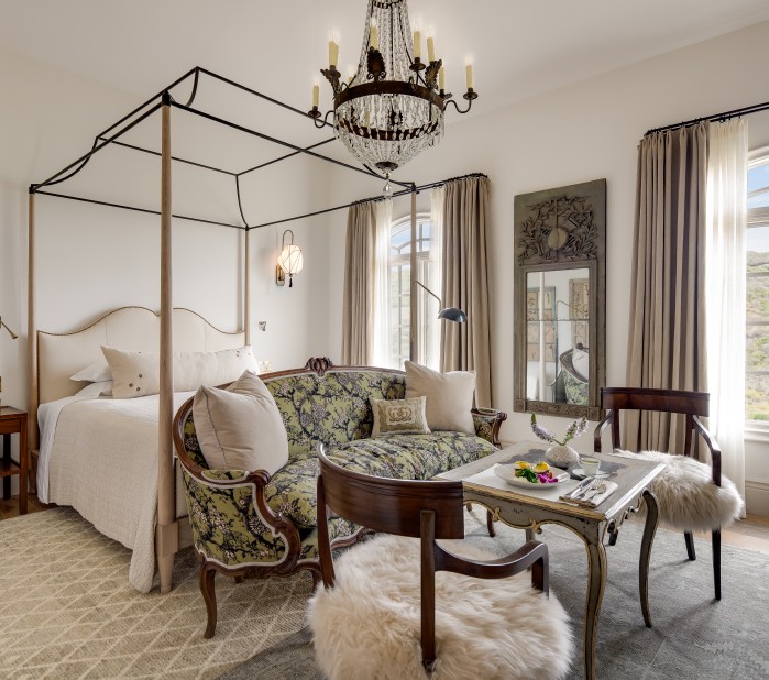 a bedroom with a bed and a couch