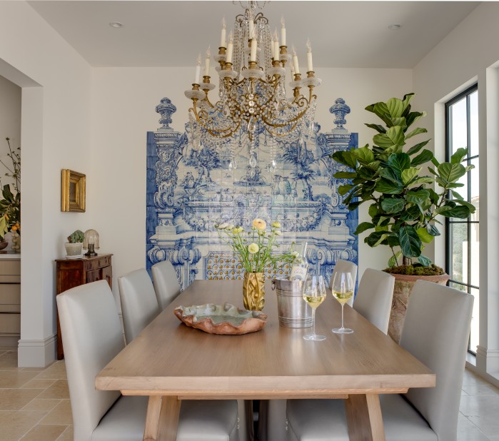 a dining table with chairs and a chandelier