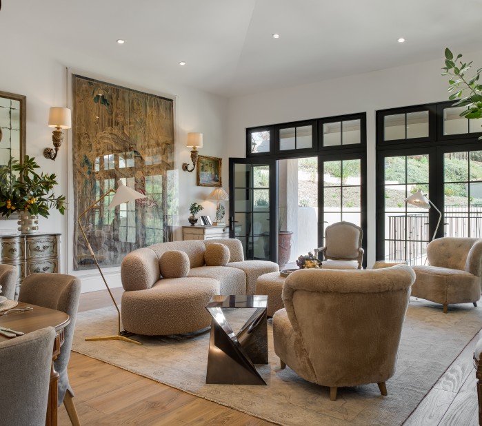 a living room with a couch and chairs