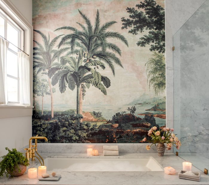 a bathroom with a bathtub and candles