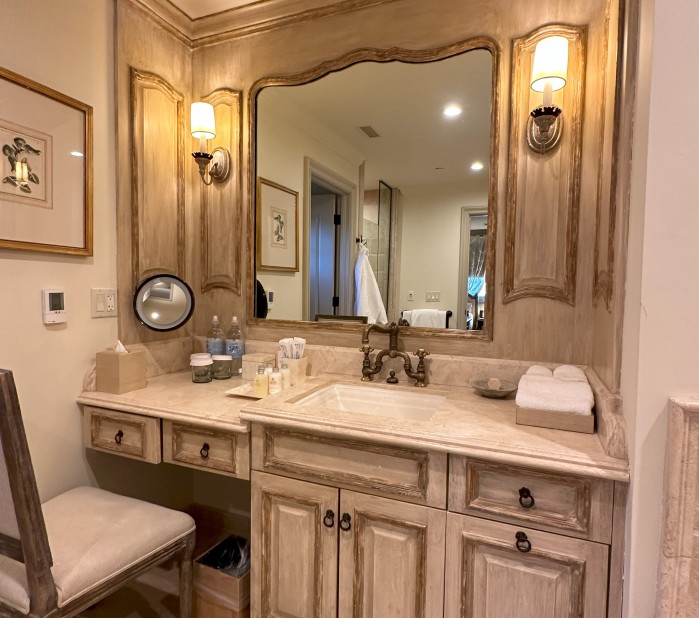a bathroom with a mirror and sink