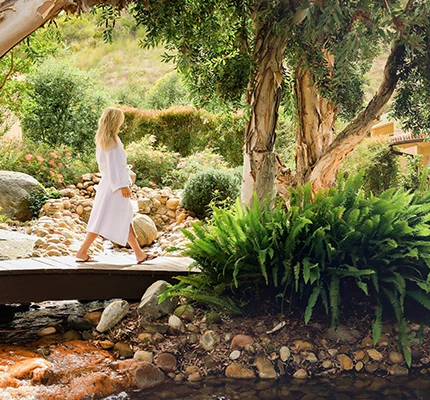 a woman walking on a bridge
