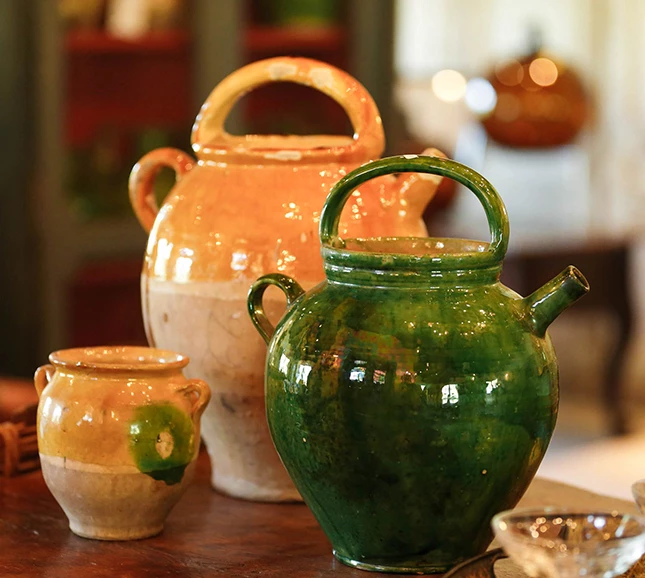 a group of ceramic pots on a table