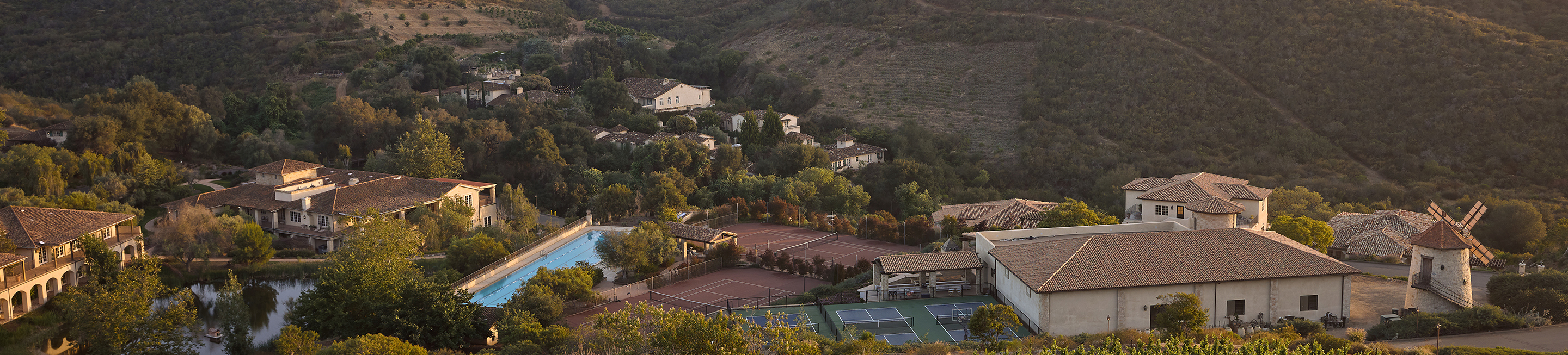 tennis courts and houses in a valley