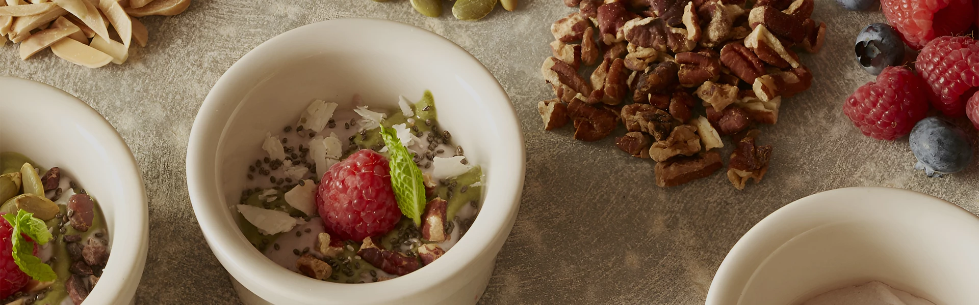 a bowl of food next to nuts