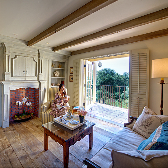 a woman sitting in a chair in a living room
