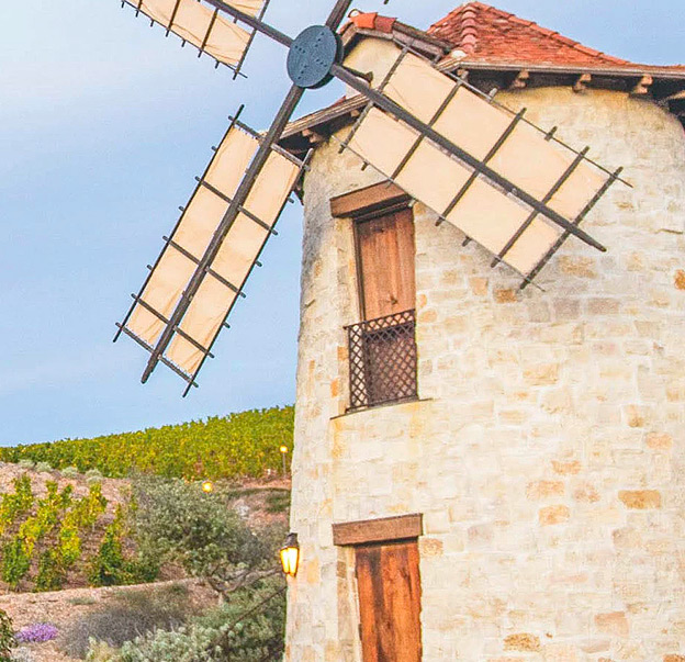 a stone building with a bell