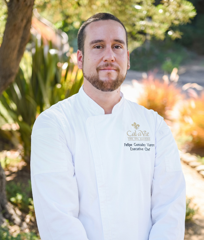 a man in a white chef coat