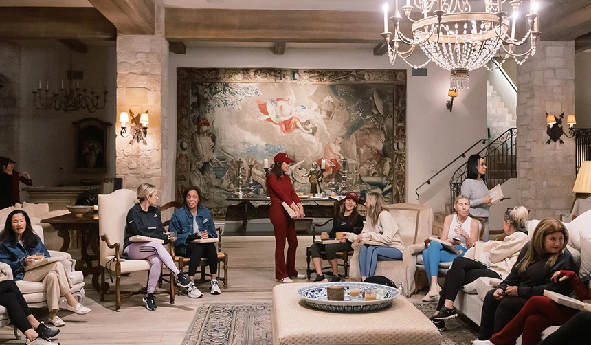 a group of women sitting in a room