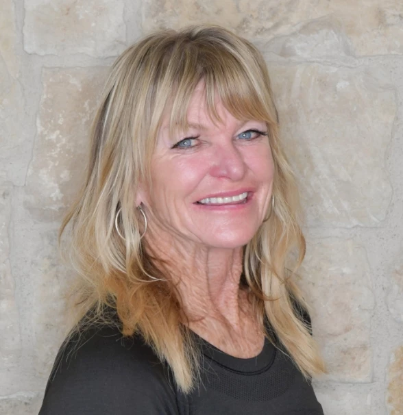 a woman smiling at the camera