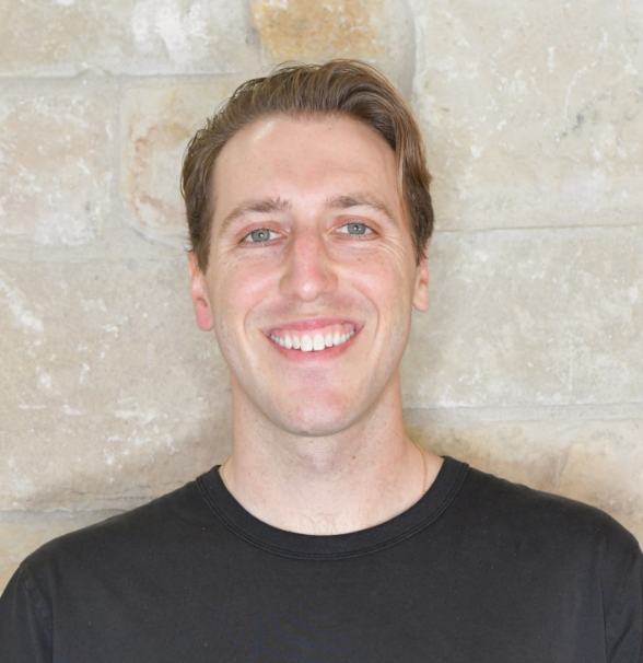 a man smiling at camera