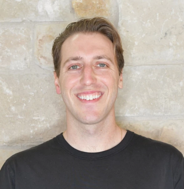 a man smiling at camera