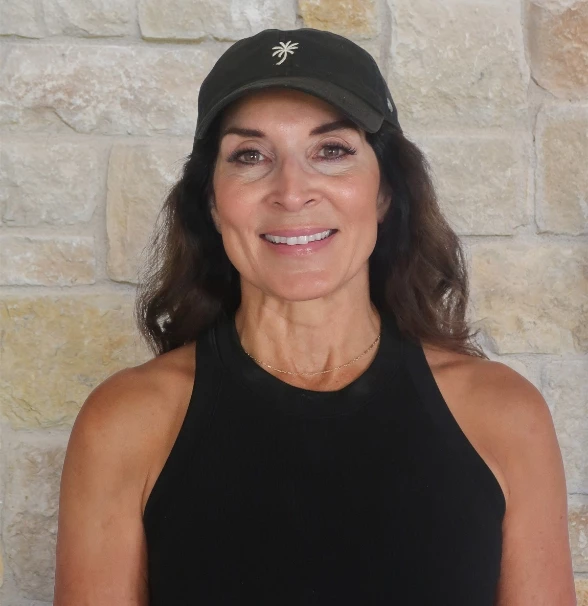 a woman wearing a black hat