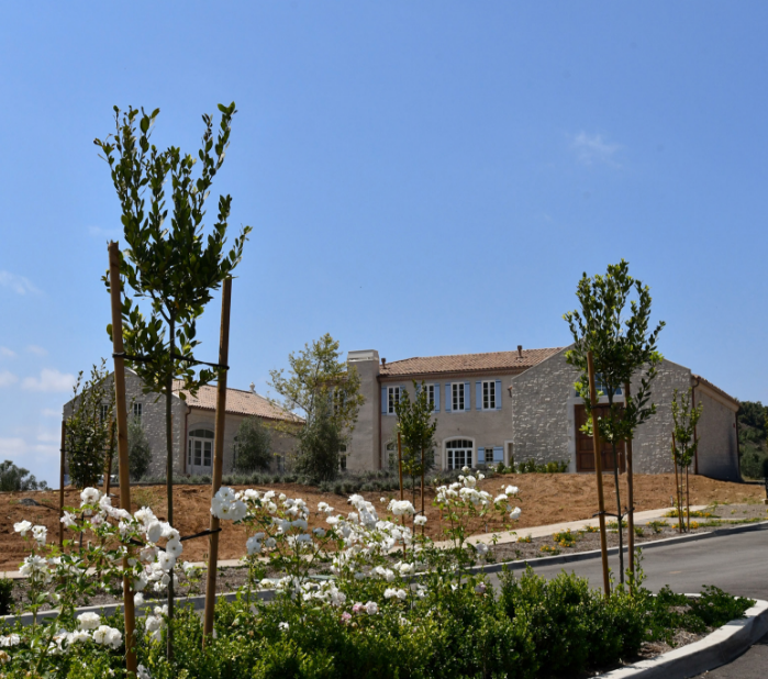 a house with a garden and trees