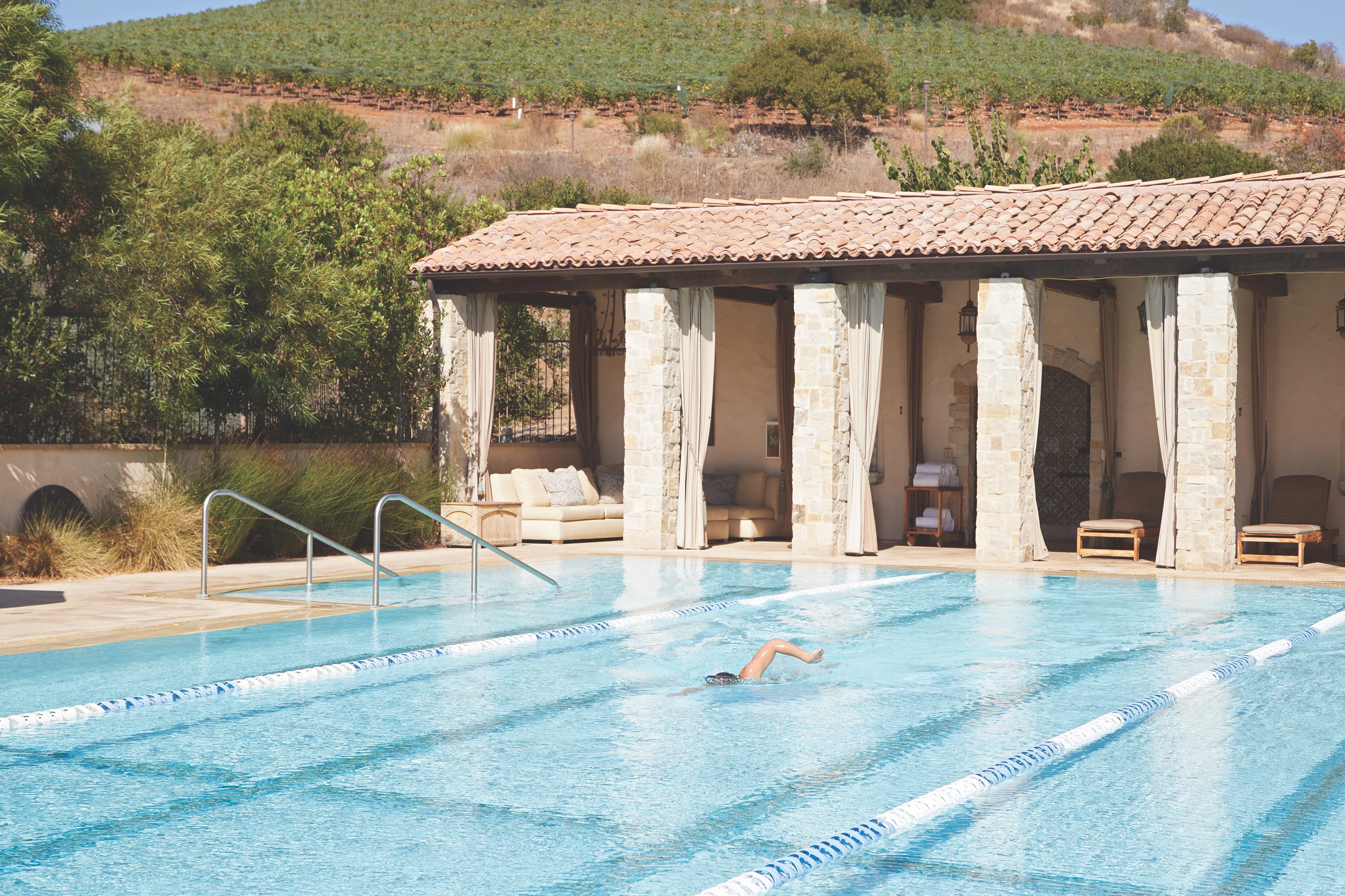 a person swimming in a pool