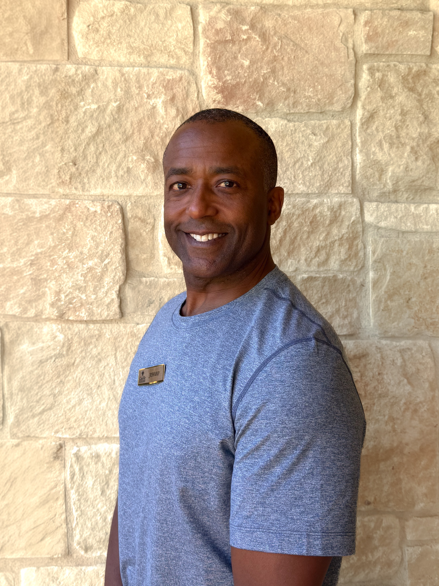 a man smiling at the camera